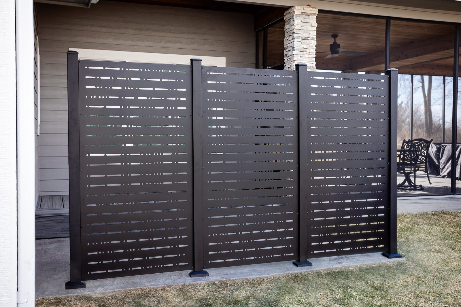 PrivacyPlus+ aluminum privacy panels on a covered patio