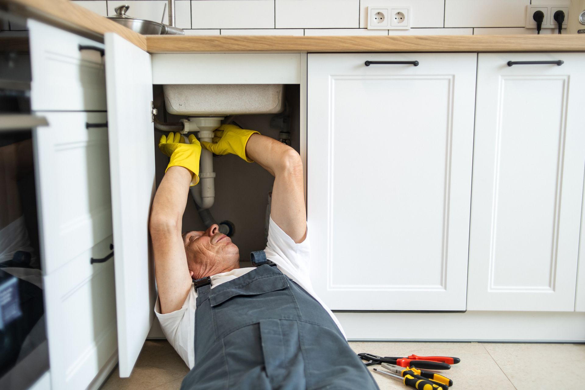 Worker Fixing the Heater — Santa Margarita, CA — RSM Plumbing