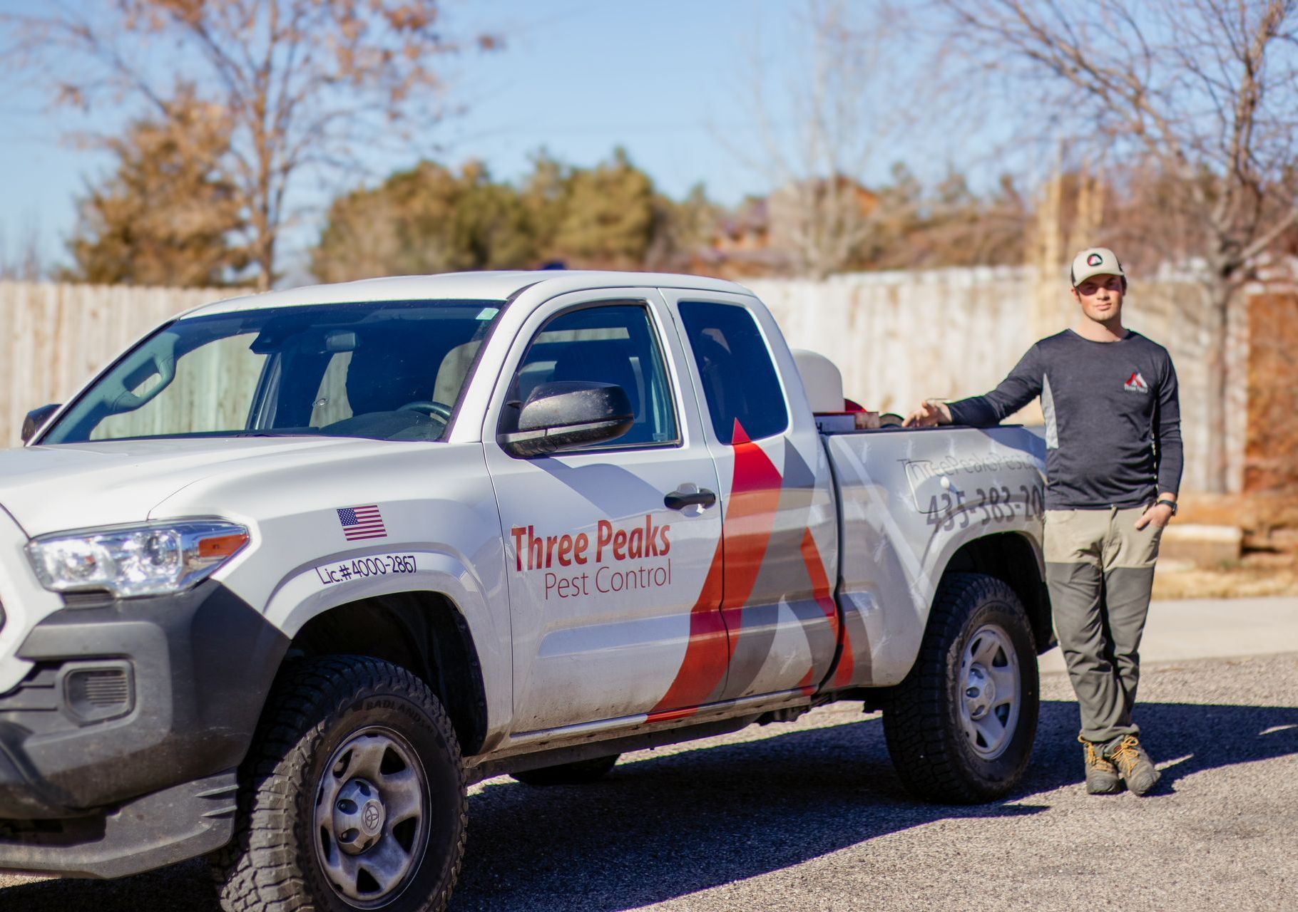 A Three Peaks Pest Control Technician posing before spaying a home in Panguitch. 