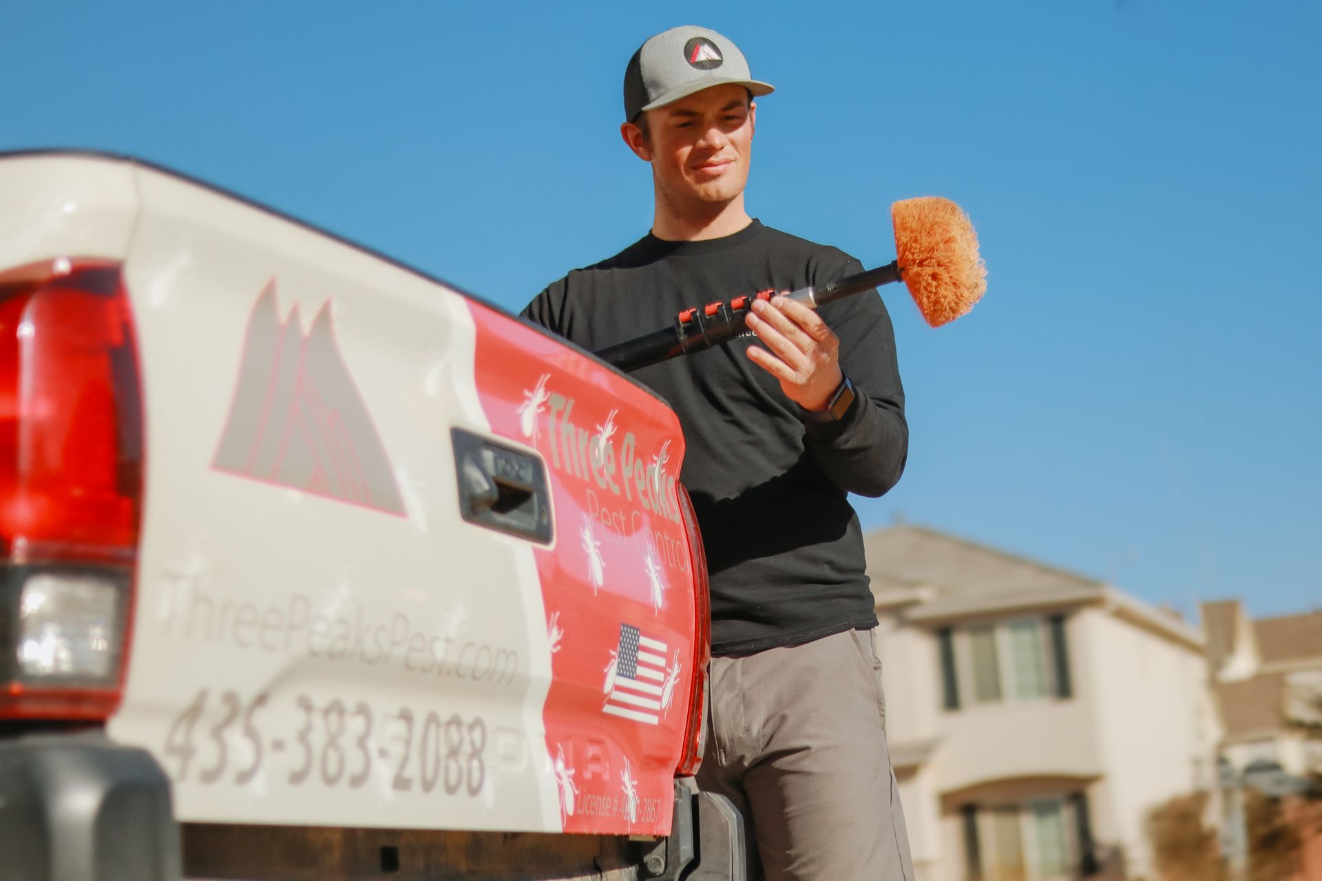 A Three Peaks Pest Control Technician is grabbing his sweeper to sweep a home in St. George Utah.