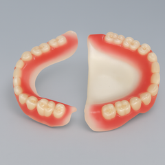 Dentist pointing at teeth on a screen during a consultation in an office.