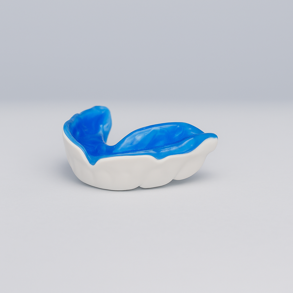 Blue-and-white dental mouthguard on a light gray background