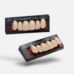 Dentist pointing at teeth on a screen during a consultation in an office.