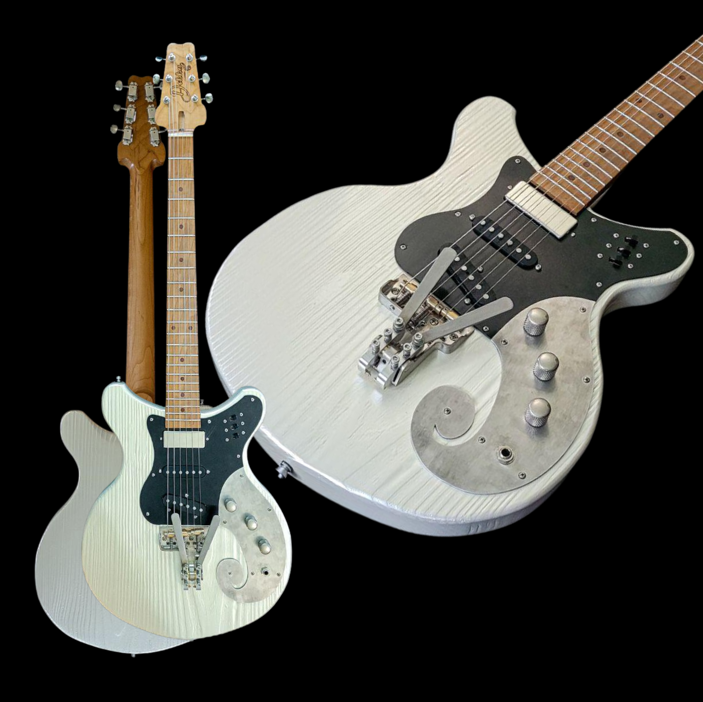 Two electric guitars, one white and one light blue, displayed on a black background