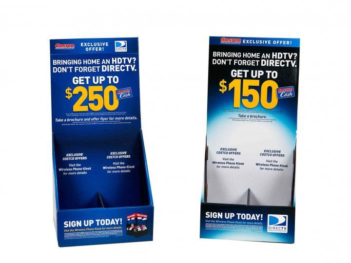 Two blue promotional display stands offering cash for homes, with “Sign up today” at the bottom.
