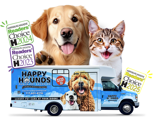 Happy Hounds mobile pet grooming van parked at a customer's home with a happy groomed dog.