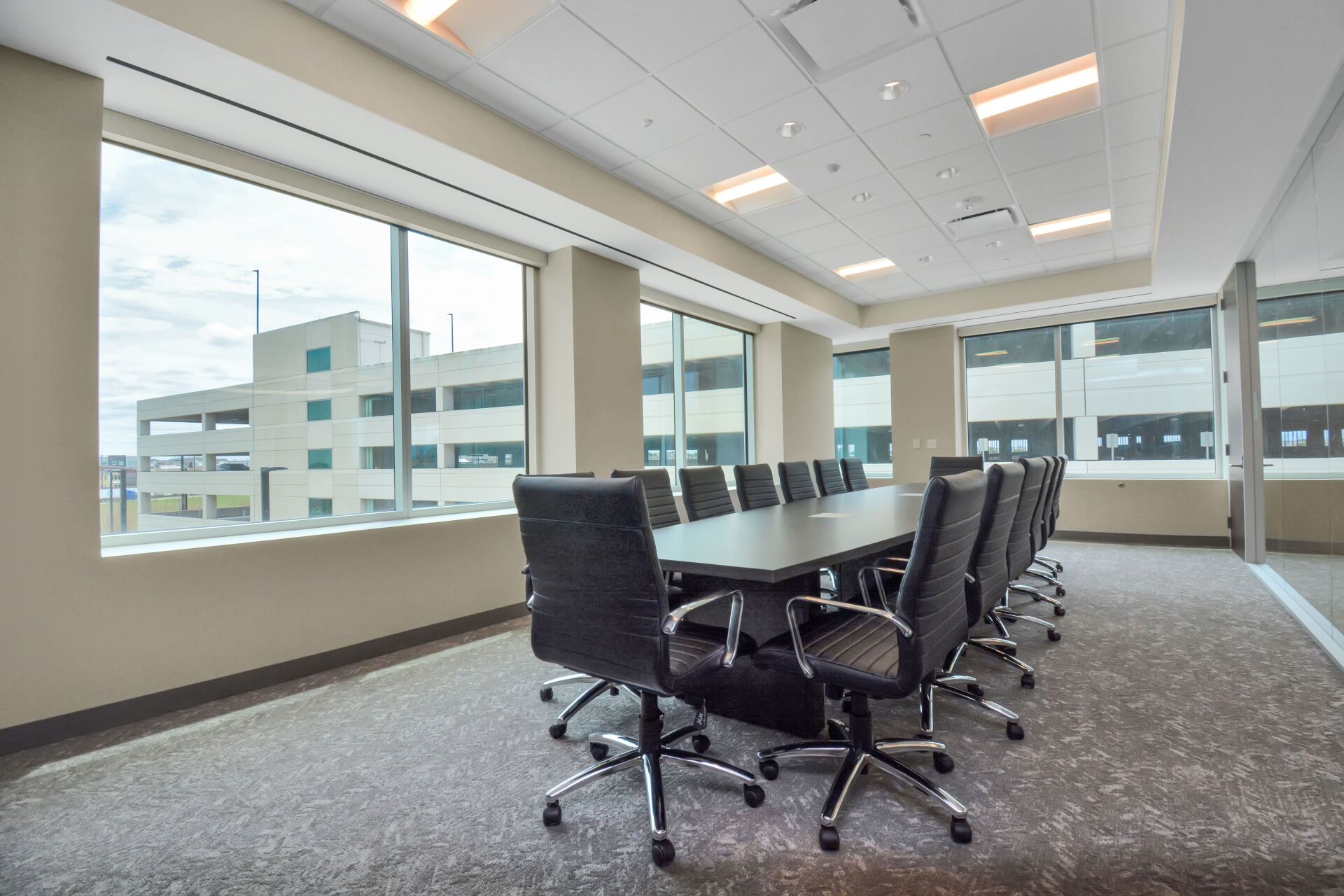 A conference room with a long table and chairs
