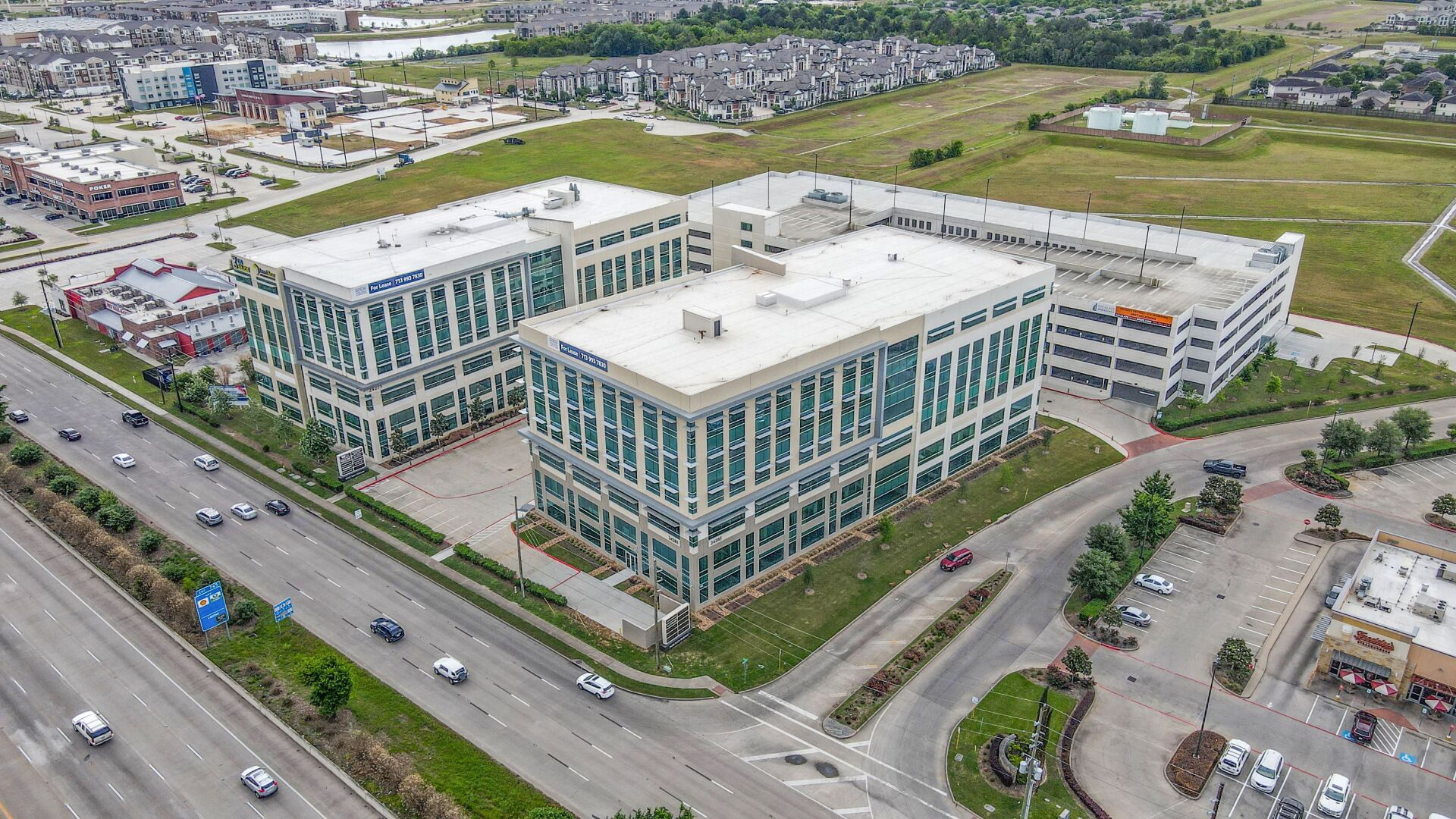 An aerial view of a large building in the middle of a city.