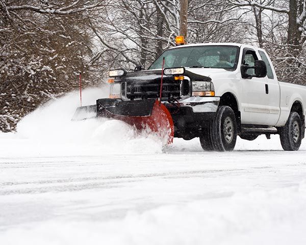 Snow Plowing the Road — Highland, IN — Allen Landscape in Highland, LLC Snow Plowing the Road — Highland, IN — Allen Landscape in Highland, LLC