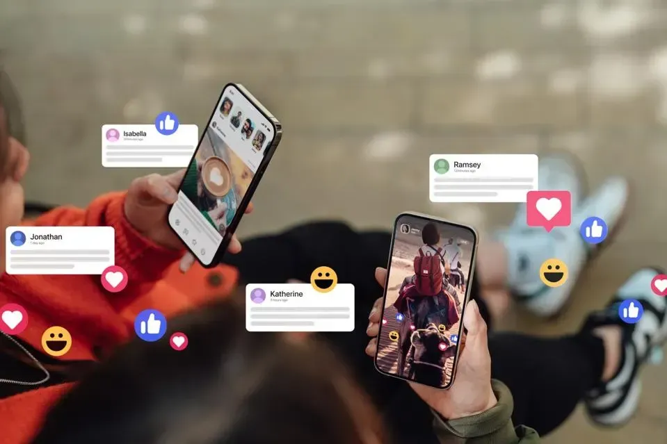 A person is holding two phones in their hands surrounded by social media icons.