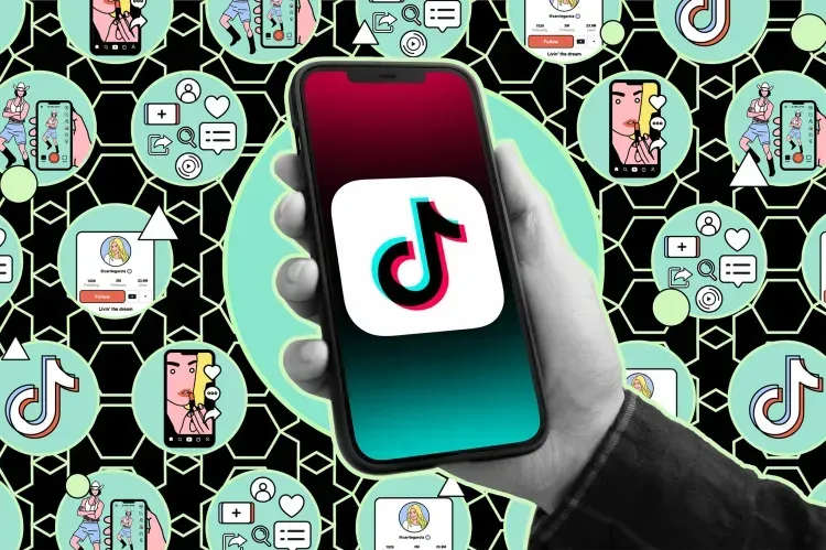 A person is holding a cell phone with the tiktok app on it.