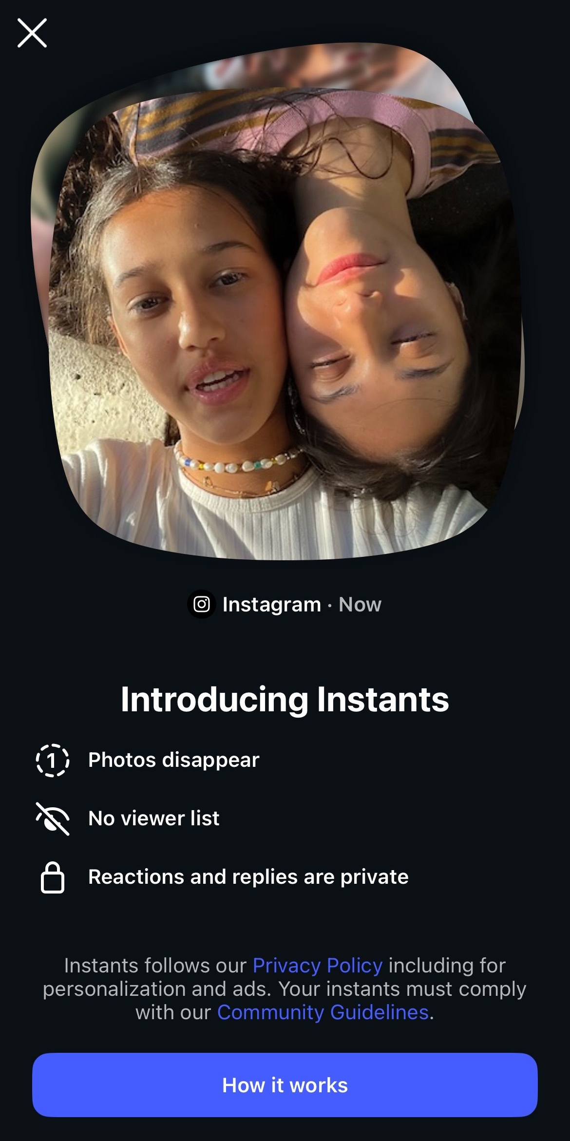 Dark app screen showing a rounded photo of two people leaning together above a blue “Start now” button.