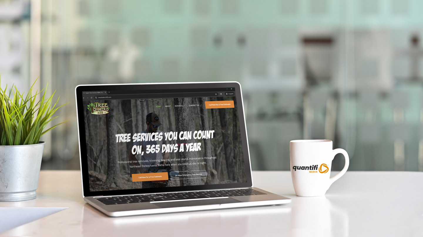 Laptop displaying a website with text 