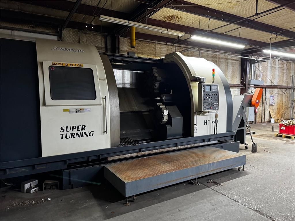 A super turning machine is sitting in a warehouse.