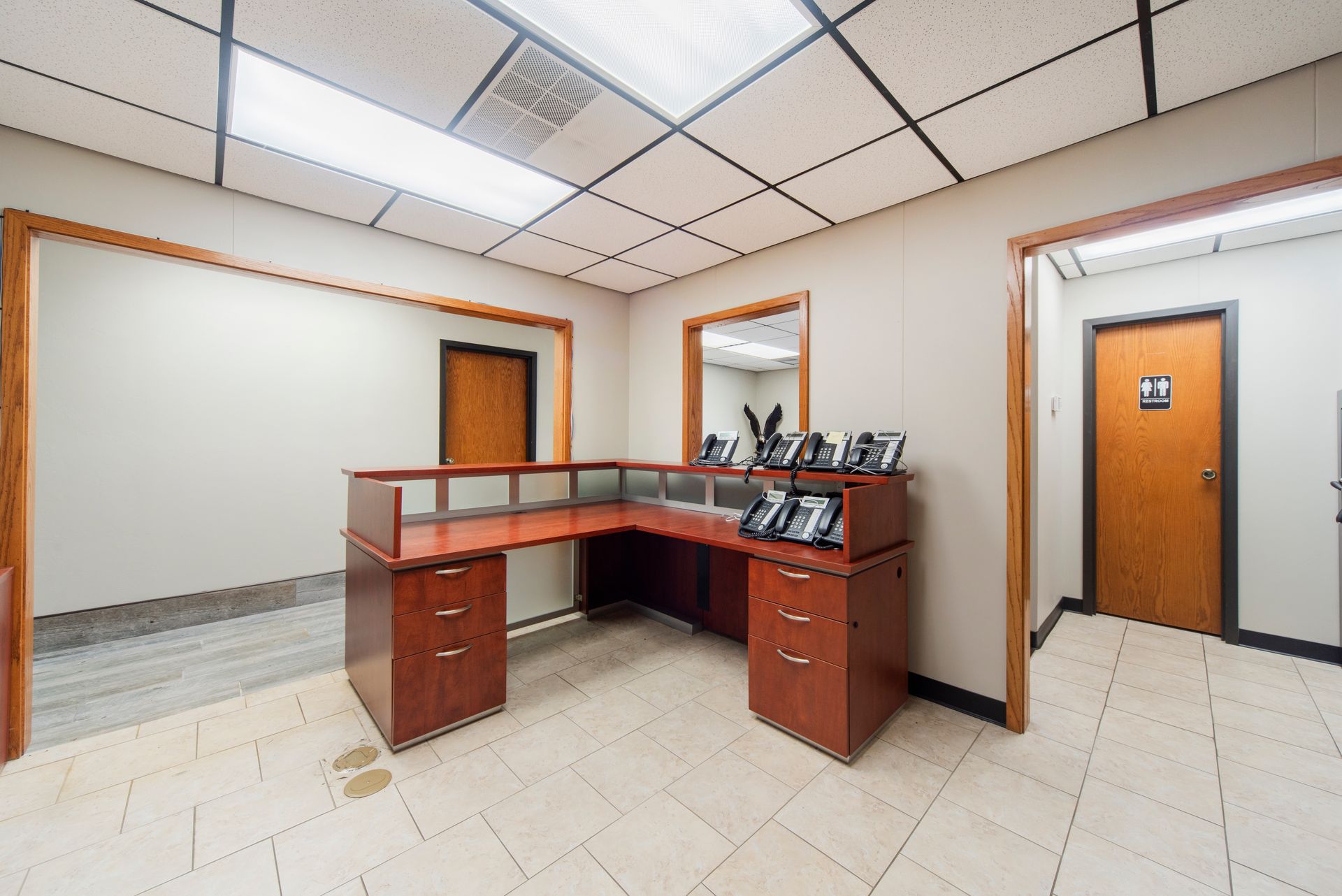There is a desk in the middle of the room.