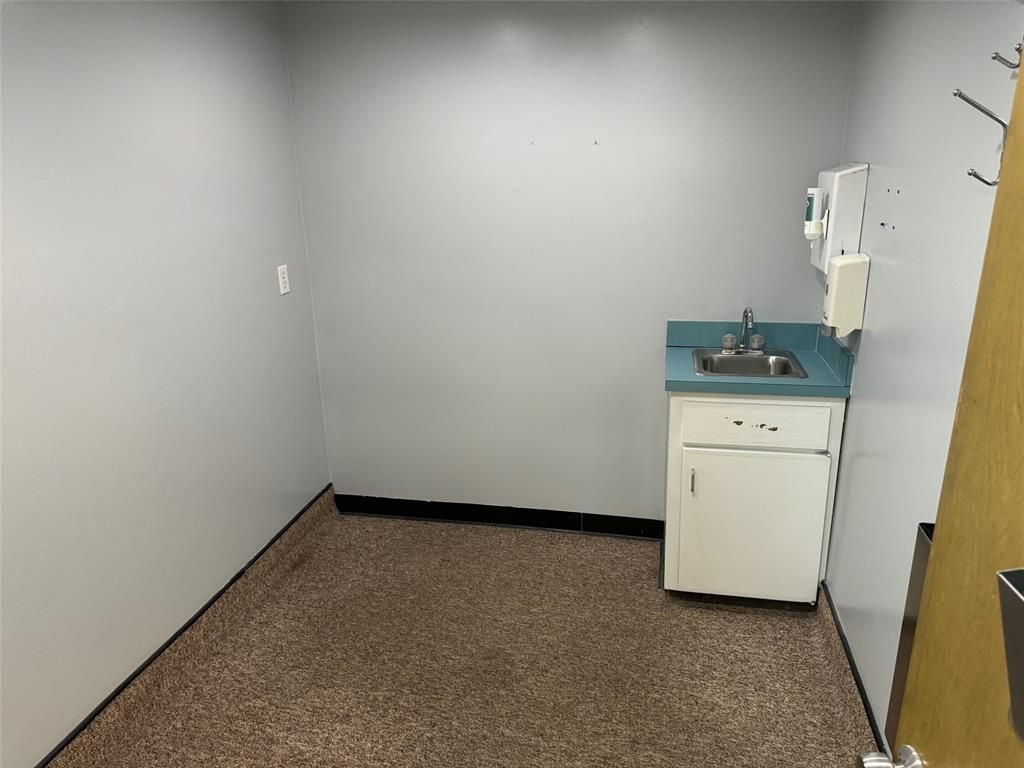There is a sink in the middle of the room.