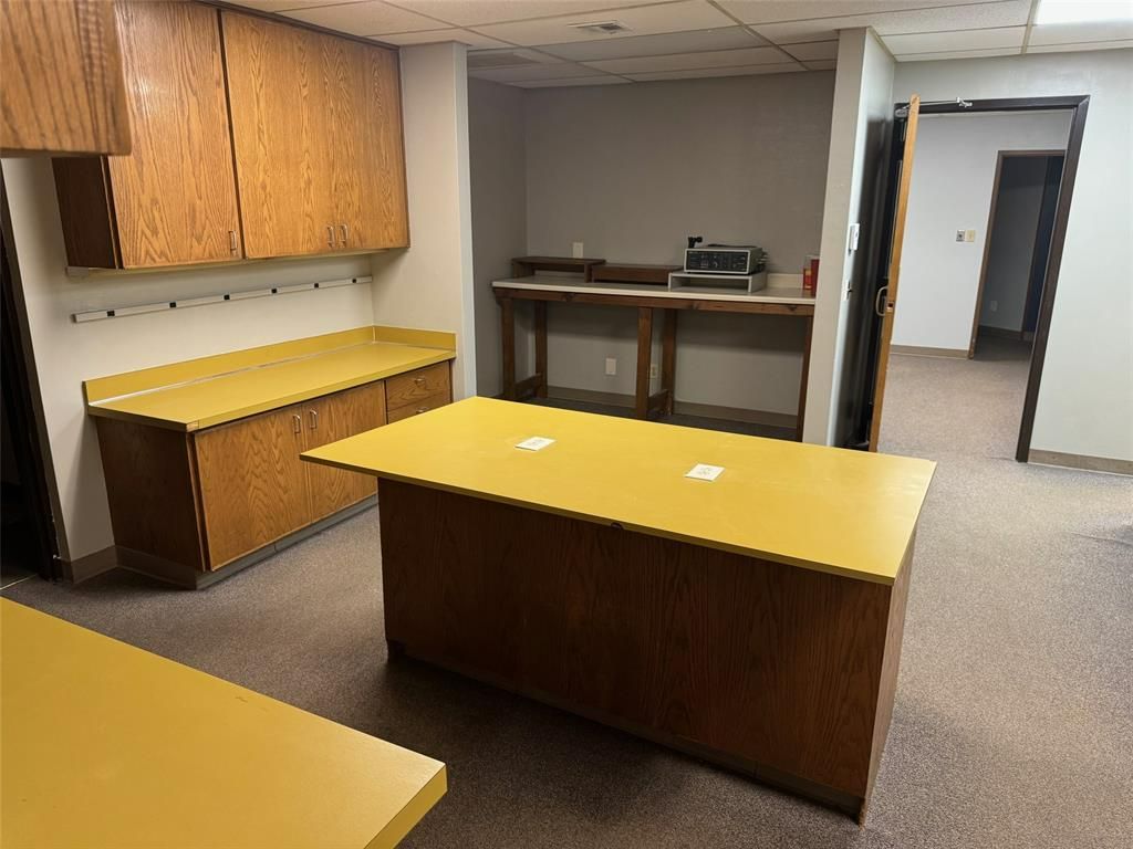 There is a large table in the middle of the room.