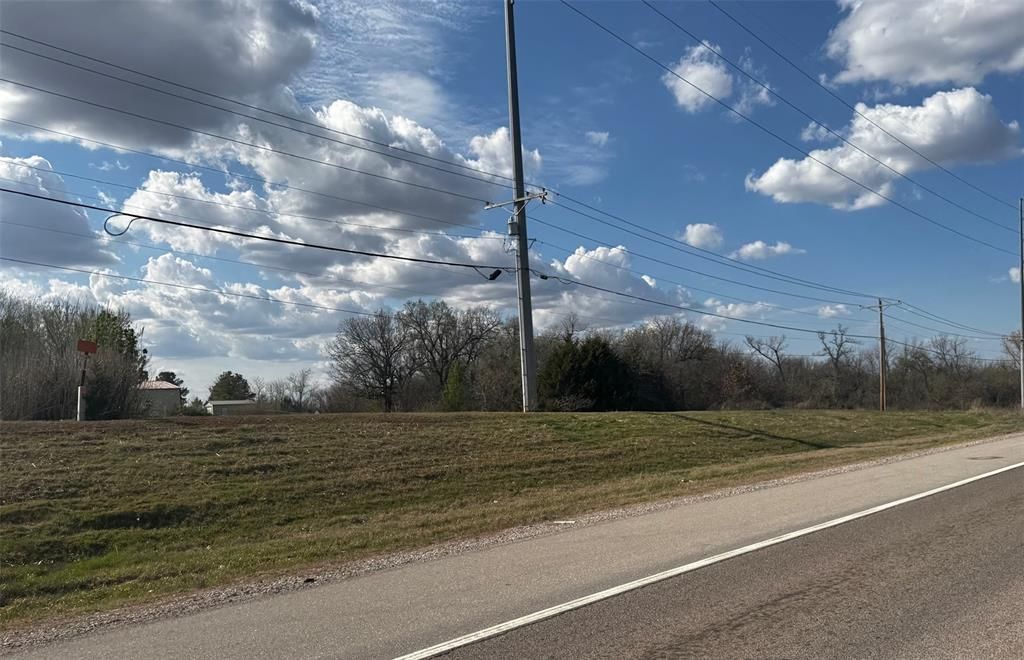 A road with a lot of clouds in the sky