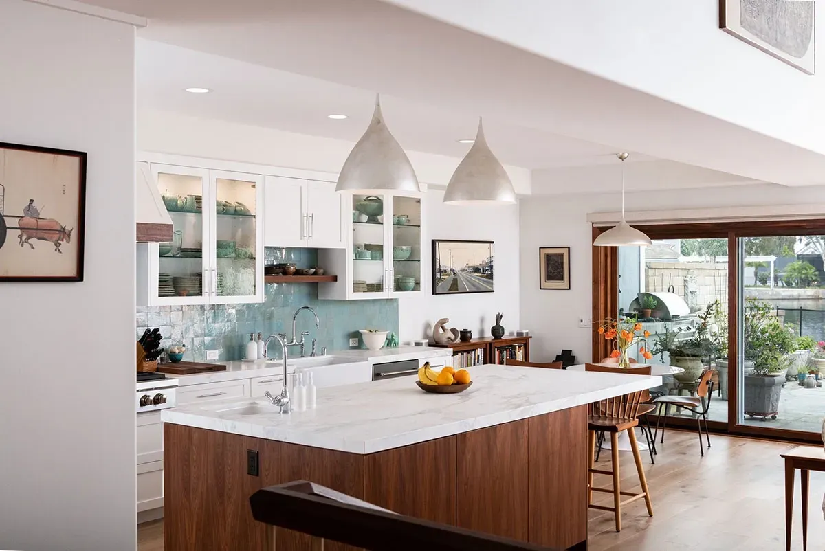 There is a large island in the middle of the kitchen.