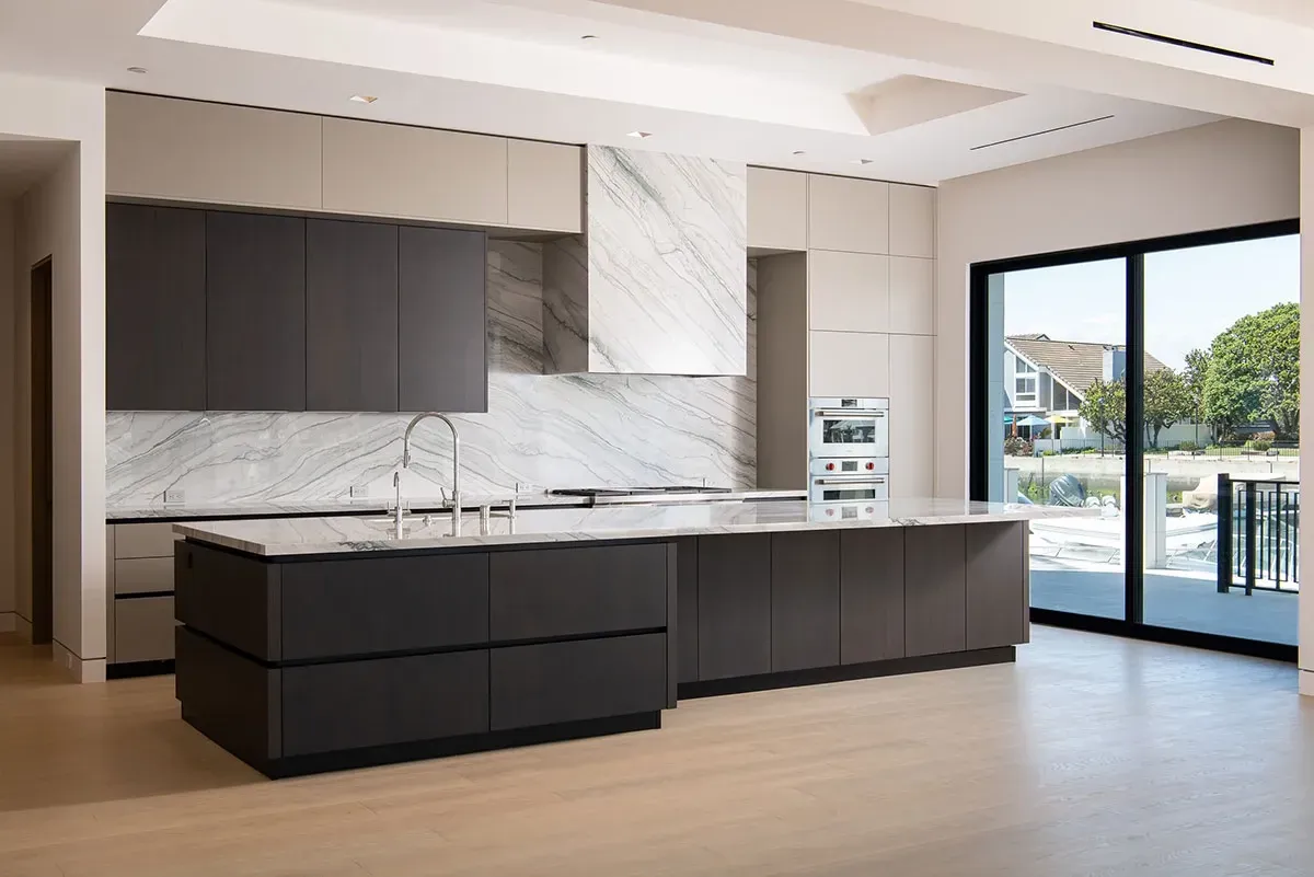 There is a large island in the middle of the kitchen.