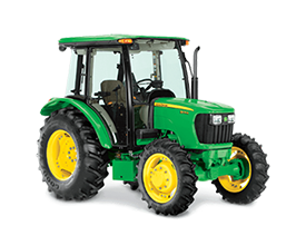 A green and yellow john deere tractor with a cab on a white background.