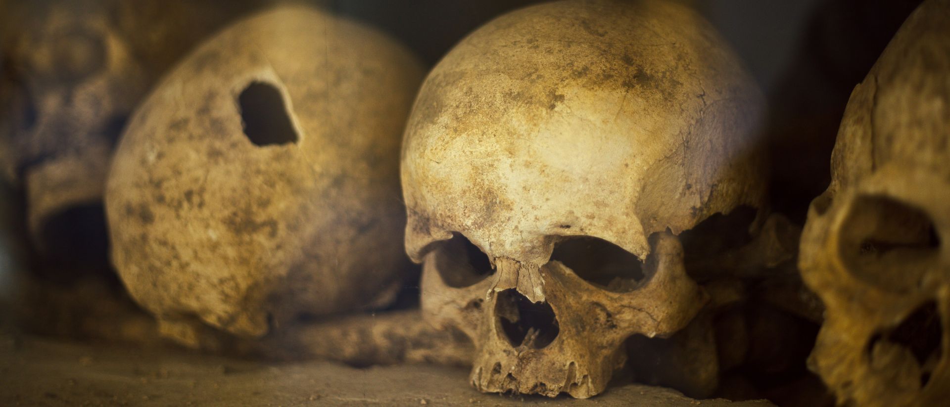 Rows of stacked human skulls and bones inside the Ossuary at the Church of St James in Brno