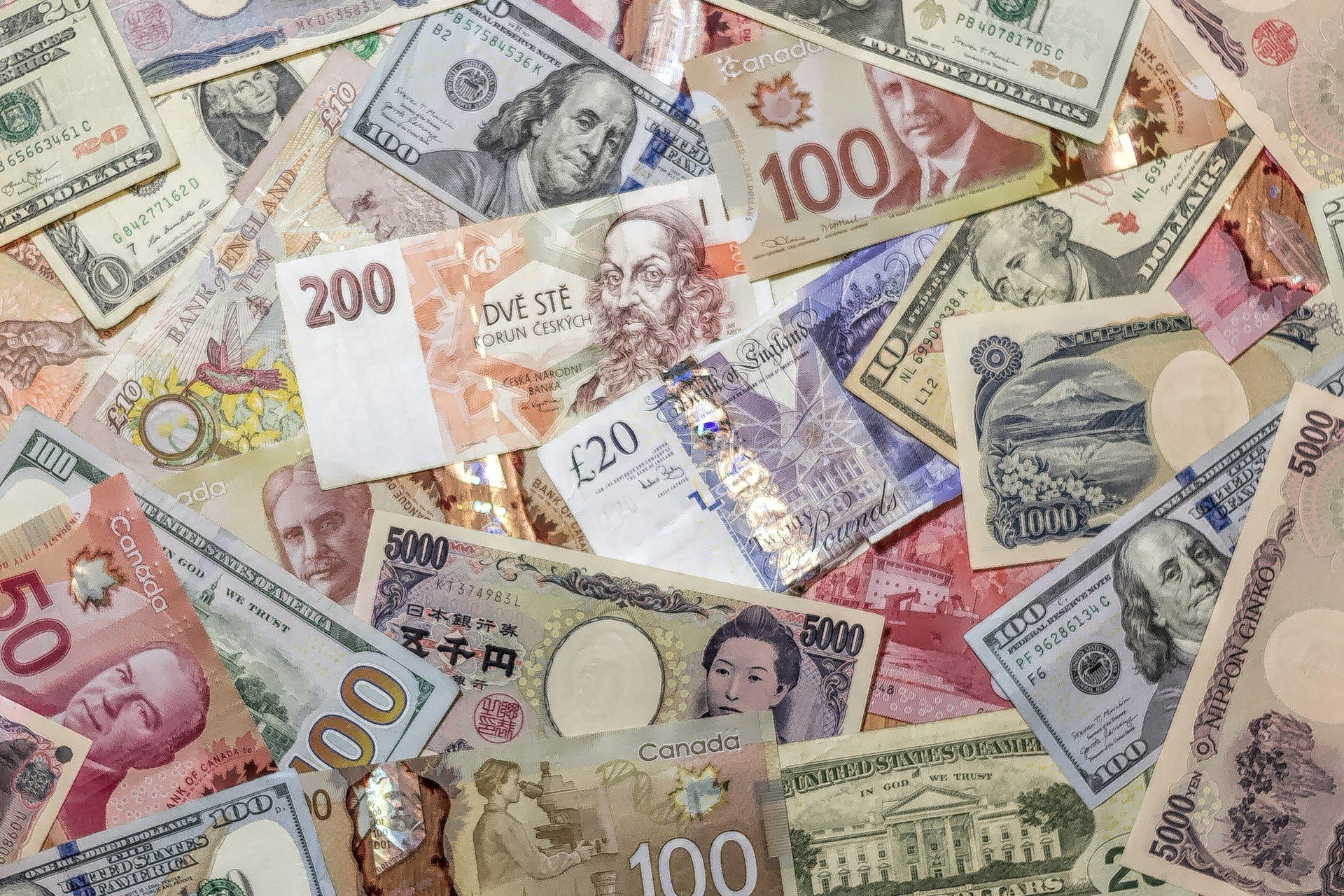 Czech koruna banknotes mixed with US dollars and other currencies