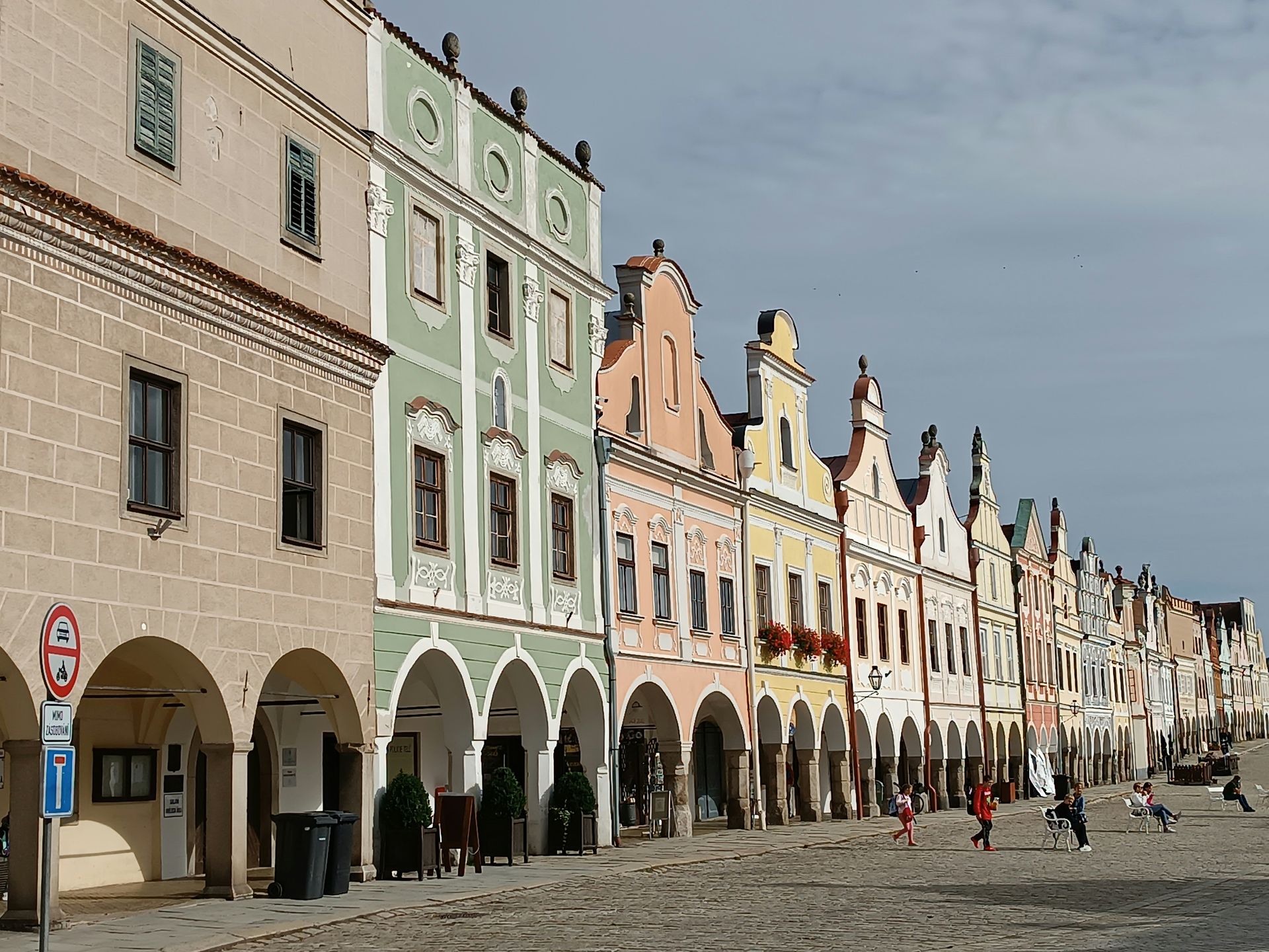 Telč Renaissance main square with pastel arcaded houses reflected in the pond, UNESCO town near Brno