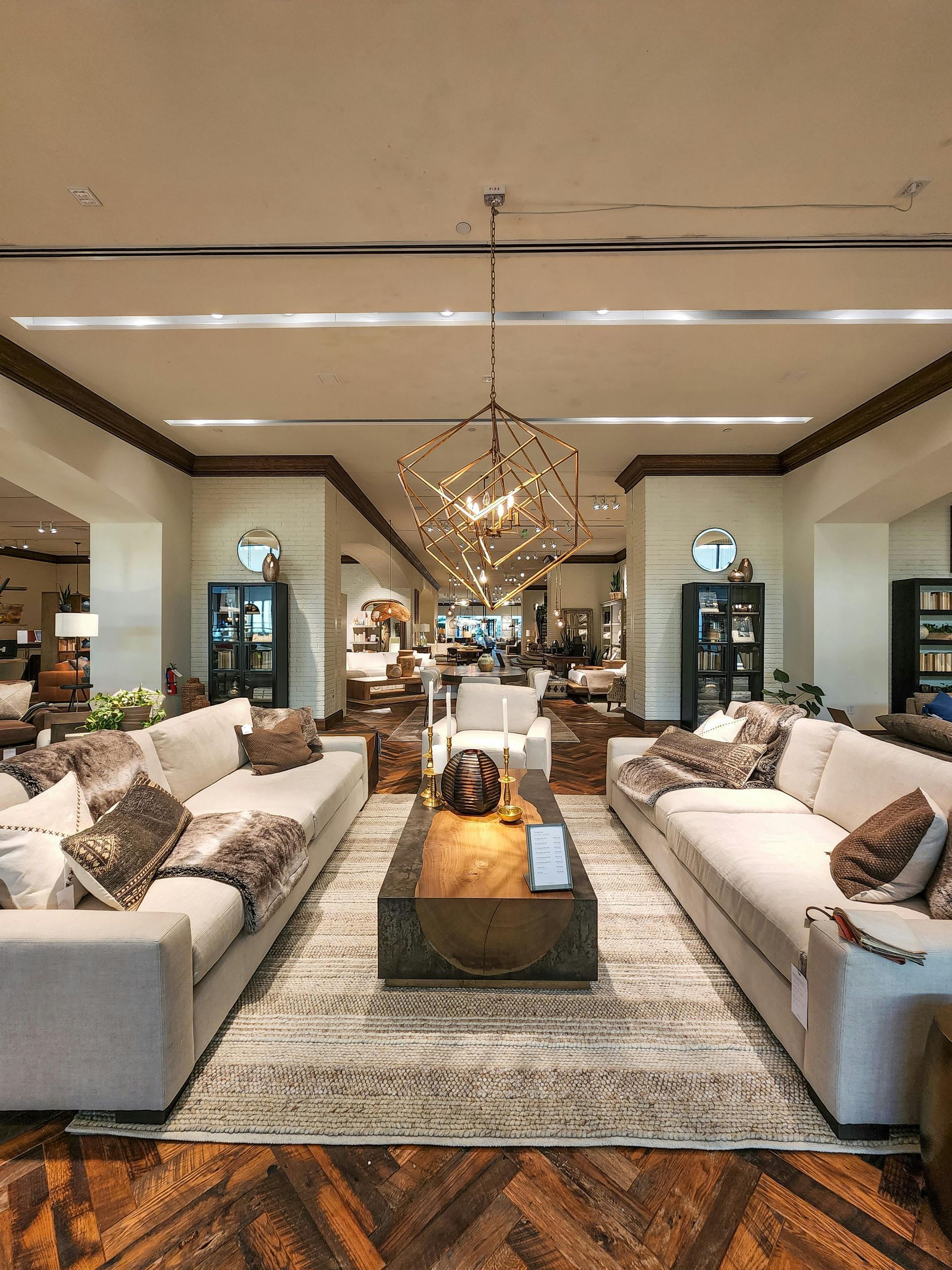 A living room filled with furniture and a chandelier.