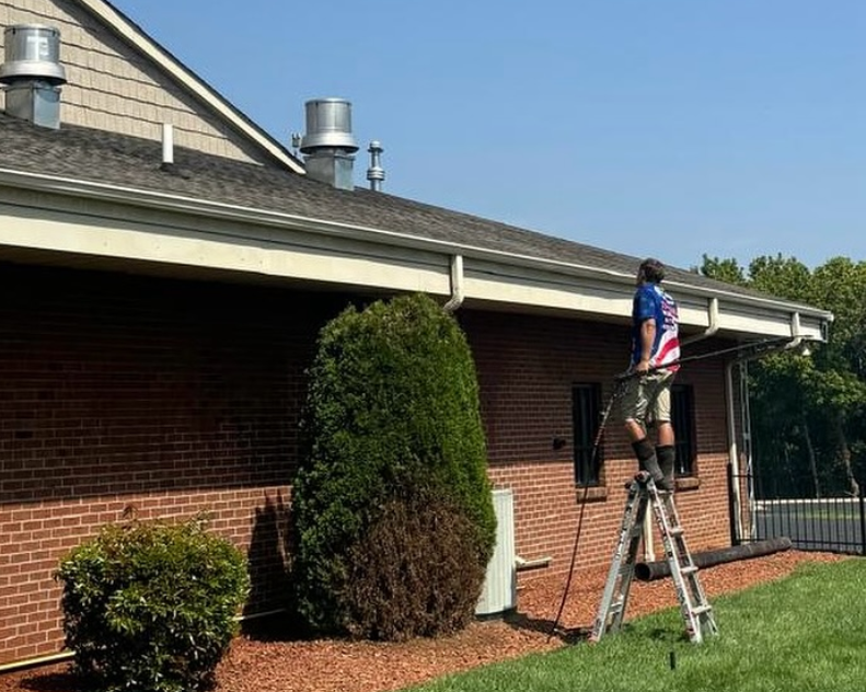 Pressure washing and detailing the roof