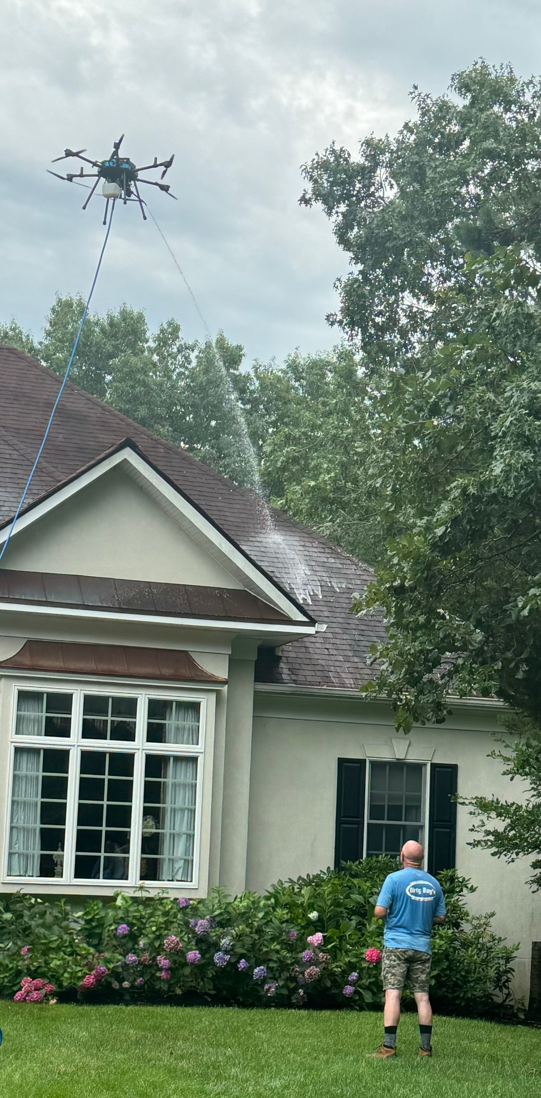 Drone pressure washing for two story home