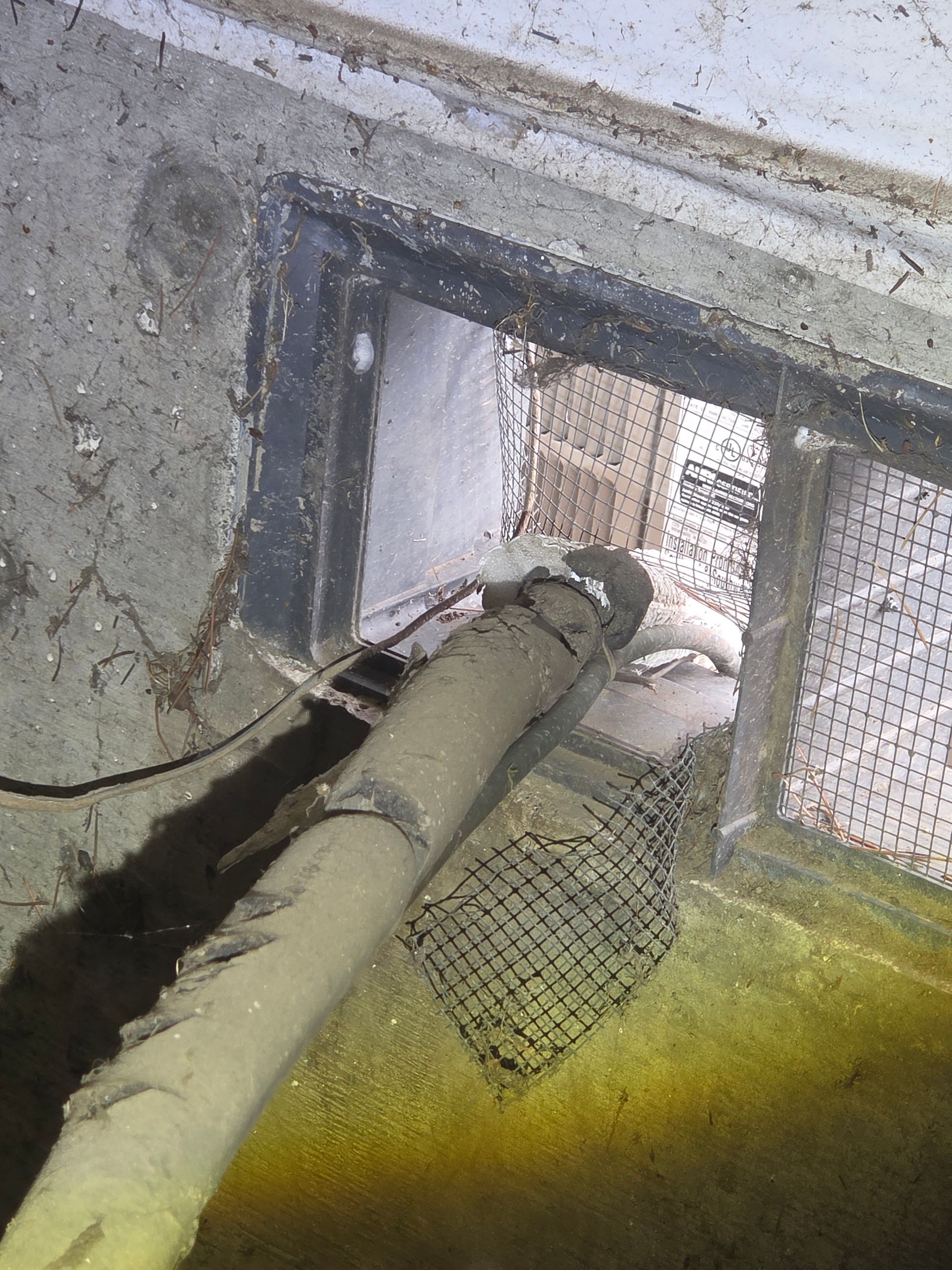 Broken foundation vent at a commercial property in Tigard, Oregon