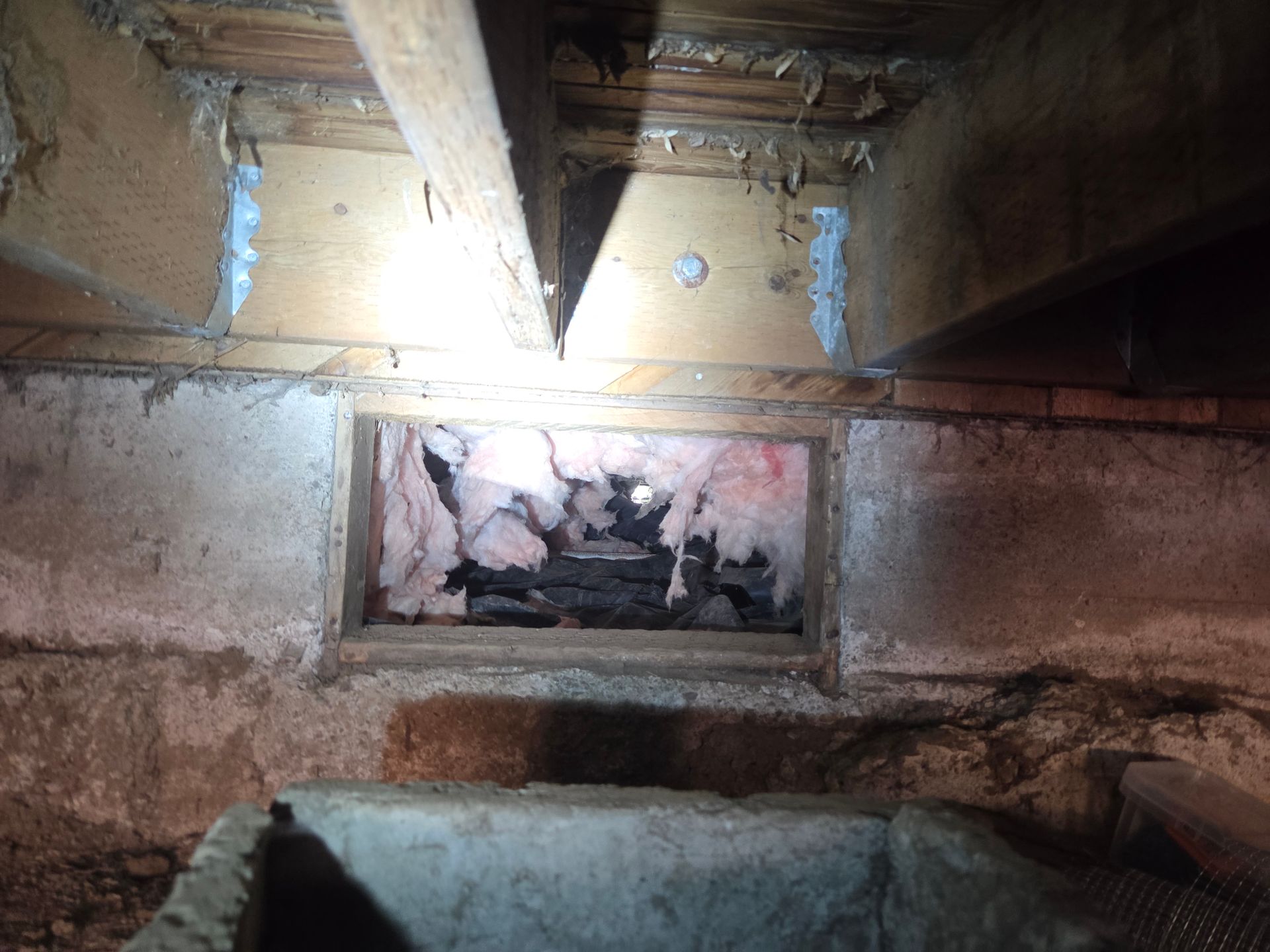 Broken foun dation vent screen at a home in Milwaukie, Oregon