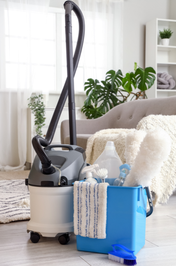 Cleaning supplies and equipment in the living room.