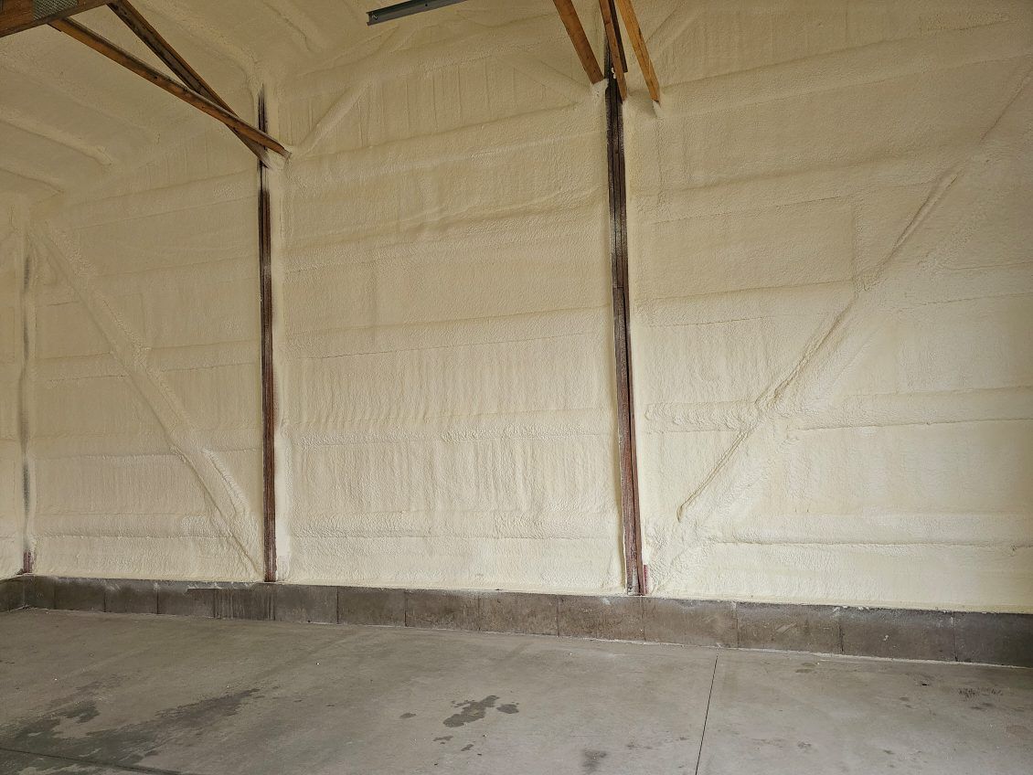A garage with a lot of insulation on the walls and ceiling.