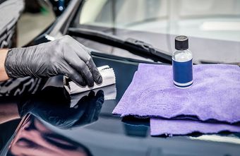 Person Doing Ceramic Coating — Plymouth, MN — Sheen Auto Spa LLC Person Doing Ceramic Coating — Plymouth, MN — Sheen Auto Spa LLC