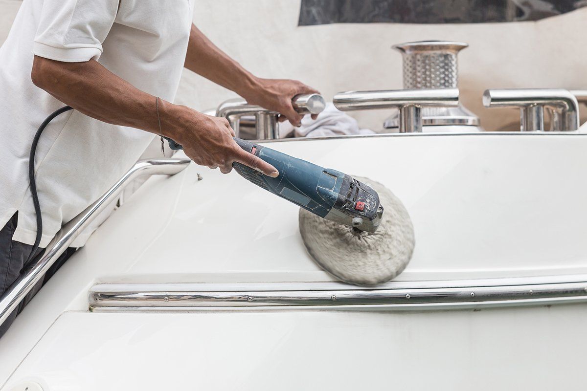 Person Doing Boat Detailing — Plymouth, MN — Sheen Auto Spa LLC Person Doing Boat Detailing — Plymouth, MN — Sheen Auto Spa LLC