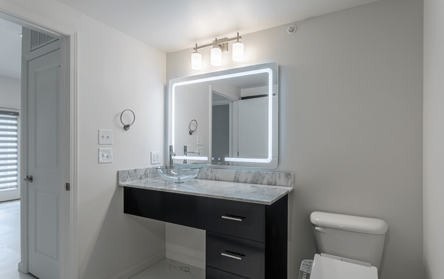 Interior of bathroom with light up vanity mirror