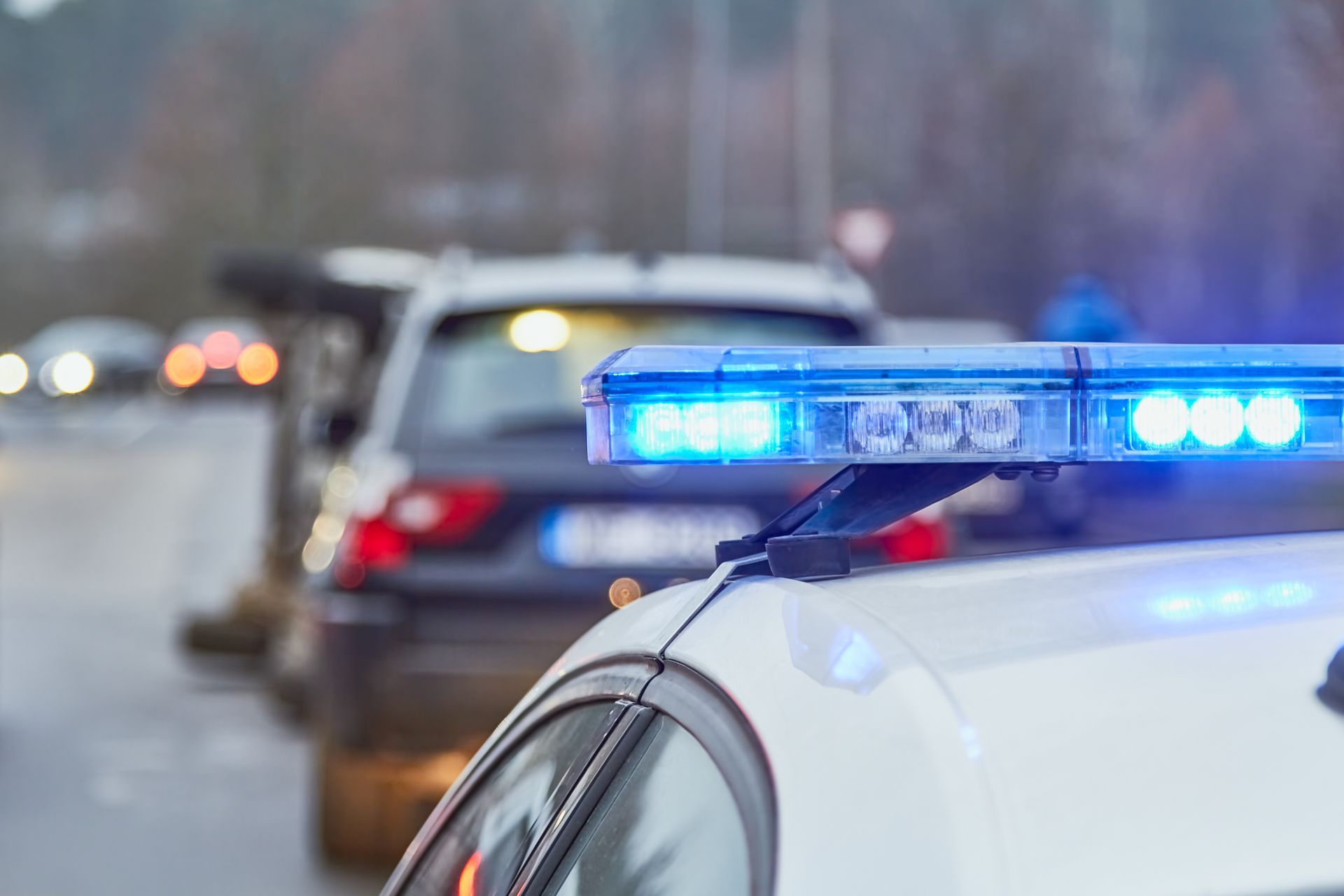 cop pulling over a car fleeing from an accident