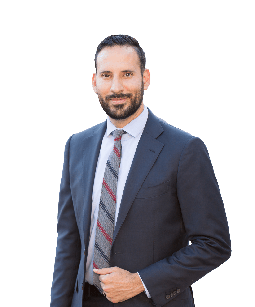 A professional headshot of a person with a beard, wearing a dark blue suit, light shirt, and a striped tie.
