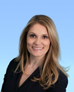 Dr. Andrea Fonner - Course Co-Director A woman with long blonde hair is smiling and wearing a black jacket.
