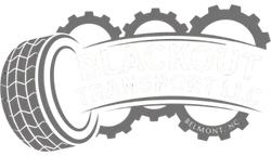Monochrome tire-shaped logo with a curved banner and gear outline behind it