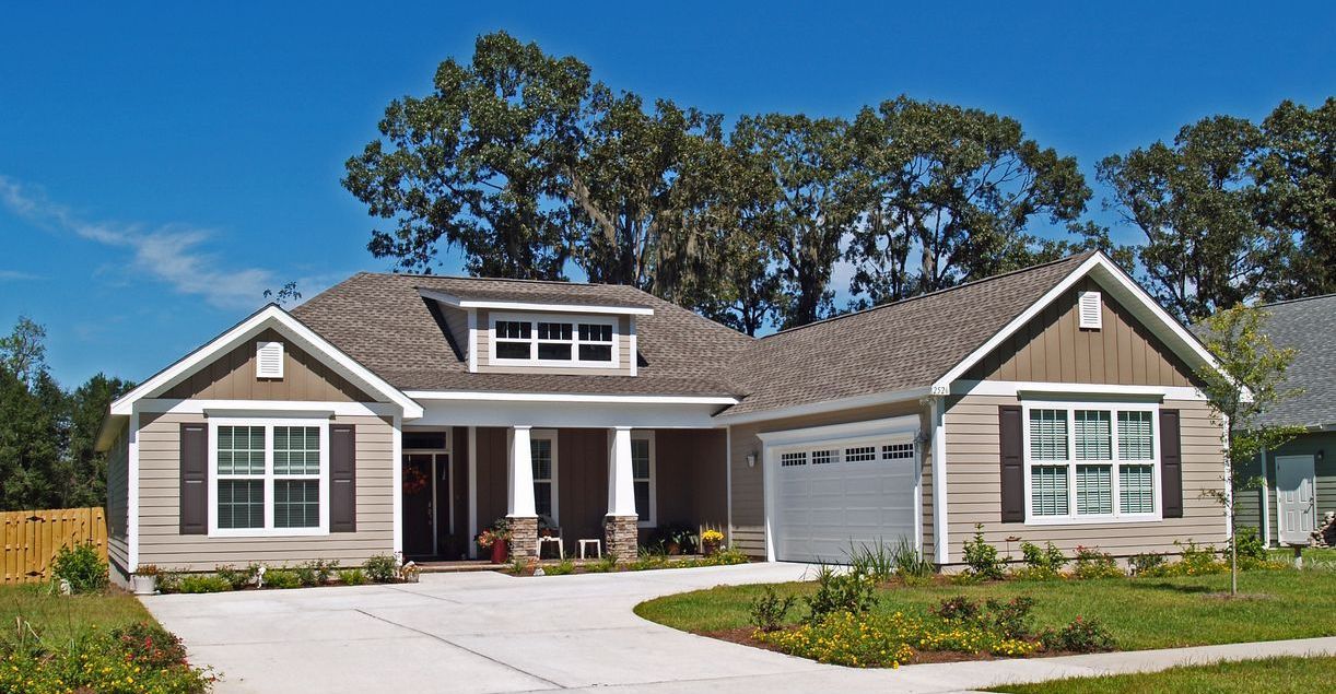 A house with a gray roof and white trim