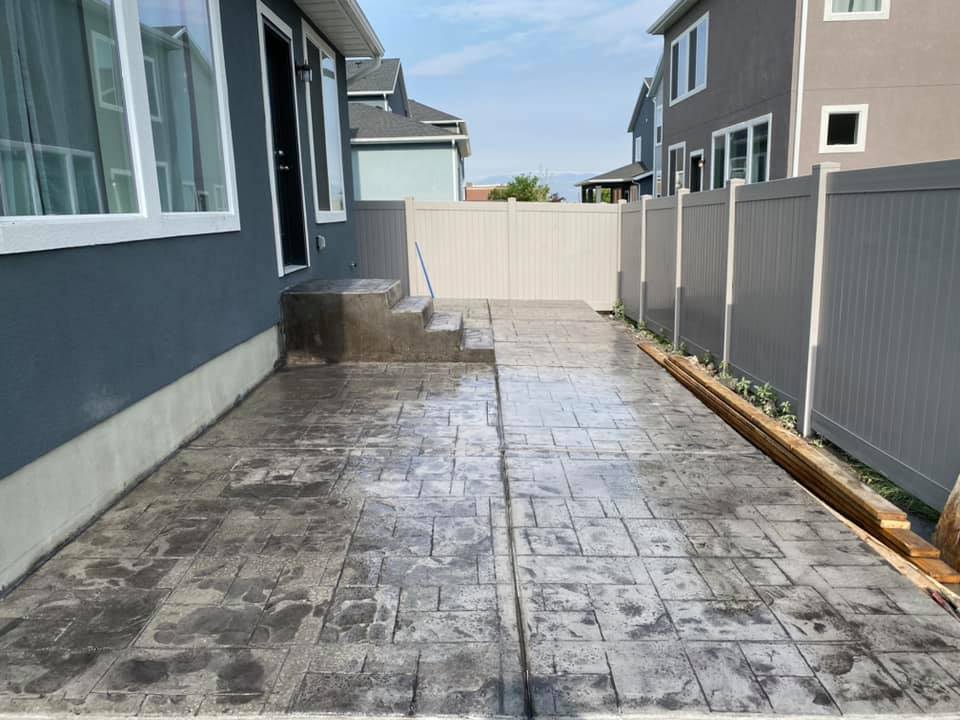 Stamped concrete patio in a backyard