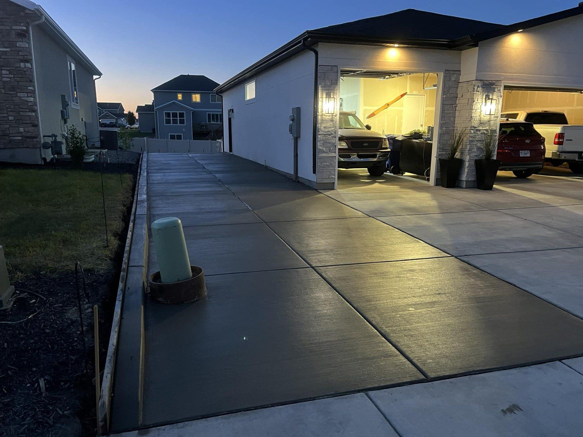Concrete driveway extension on a single family home.