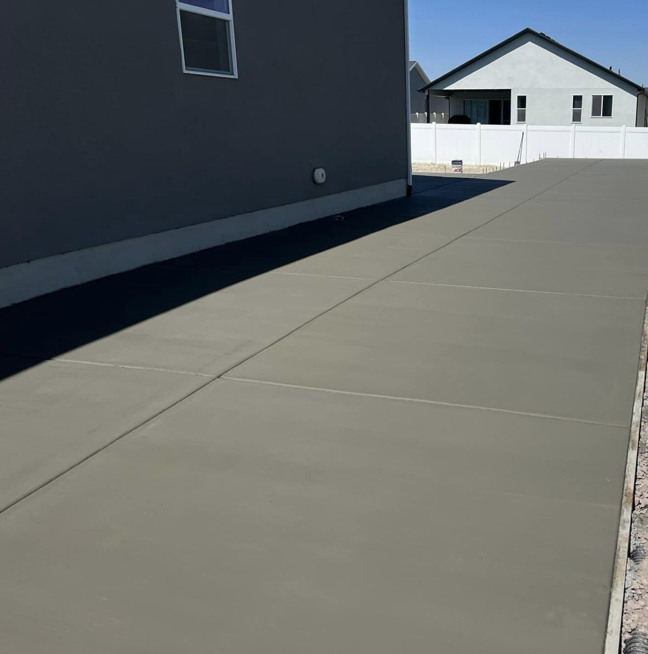 Driveway and backyard concrete flatwork on a single family home.