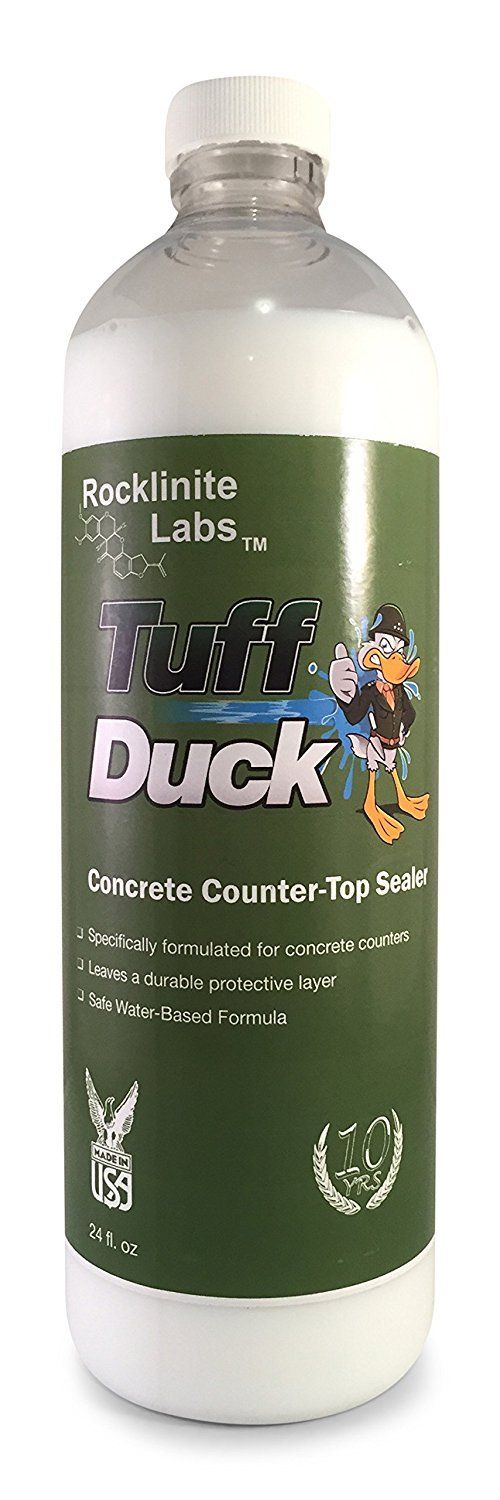 A bottle of tuff duck is sitting on a white surface.