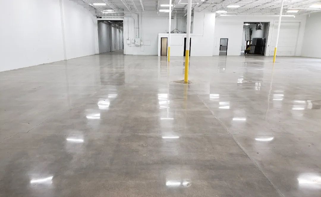 Concrete overlay with a smooth, polished finish inside a large commercial space in Greenville, SC.