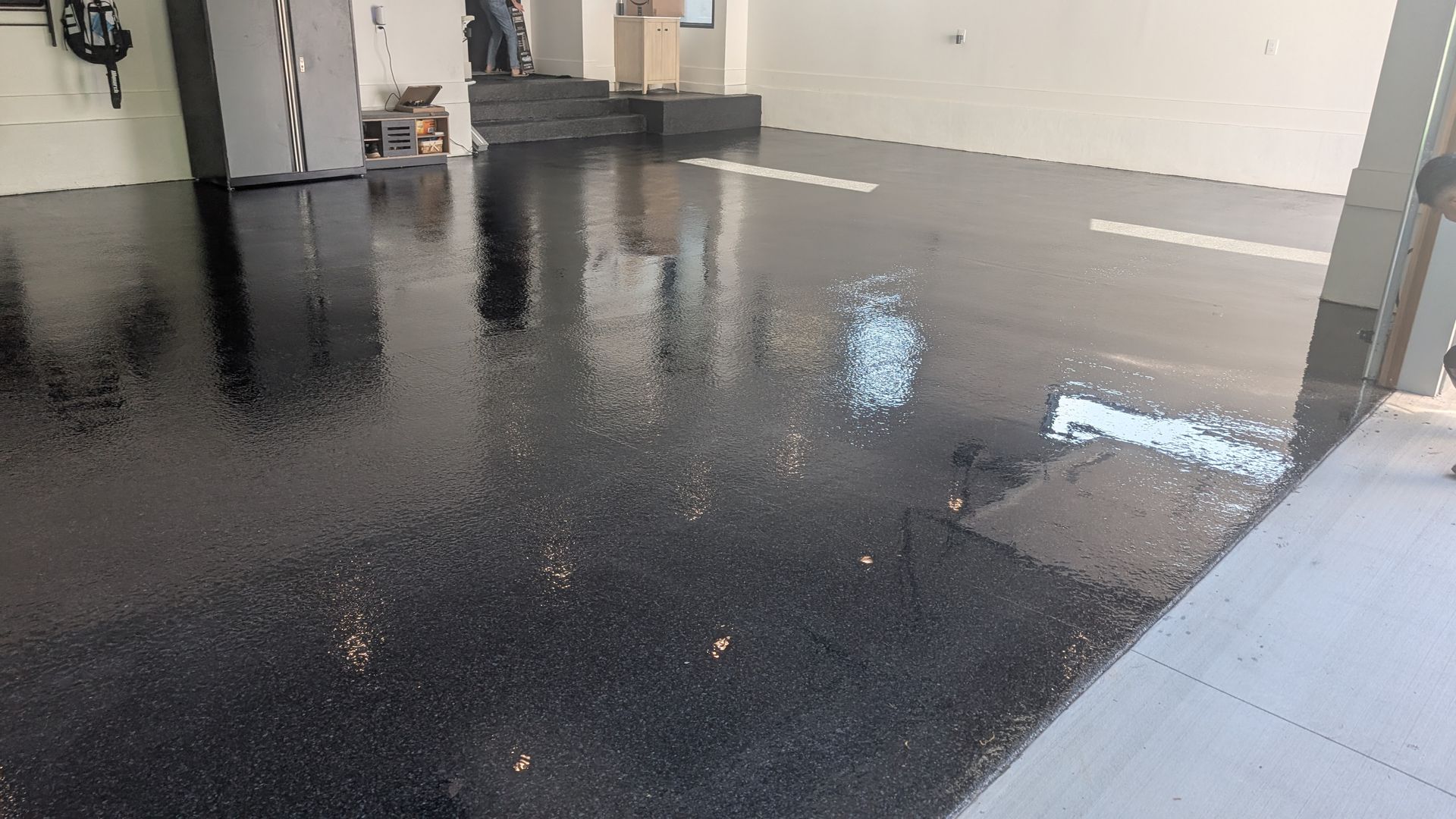 Reflective flake epoxy finish in modern garage installed by Zachary Daniel Concrete in Princeton, SC.