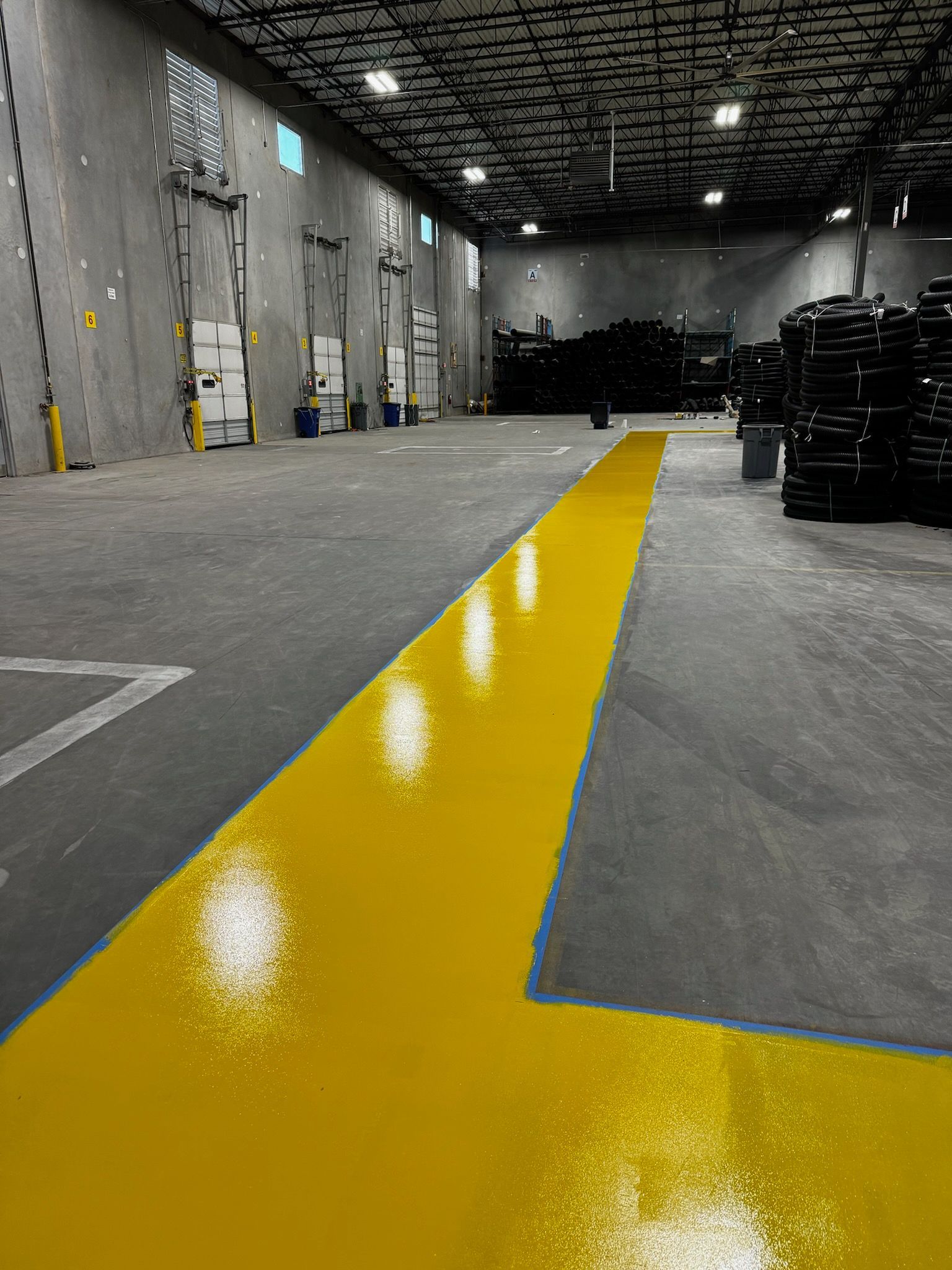 Zachary Daniel Concrete installed black metallic epoxy flooring for a garage in Concord, North Carolina.